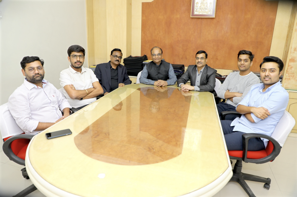 Third generation leadership team of Baba Spinners Limited seated around a conference table